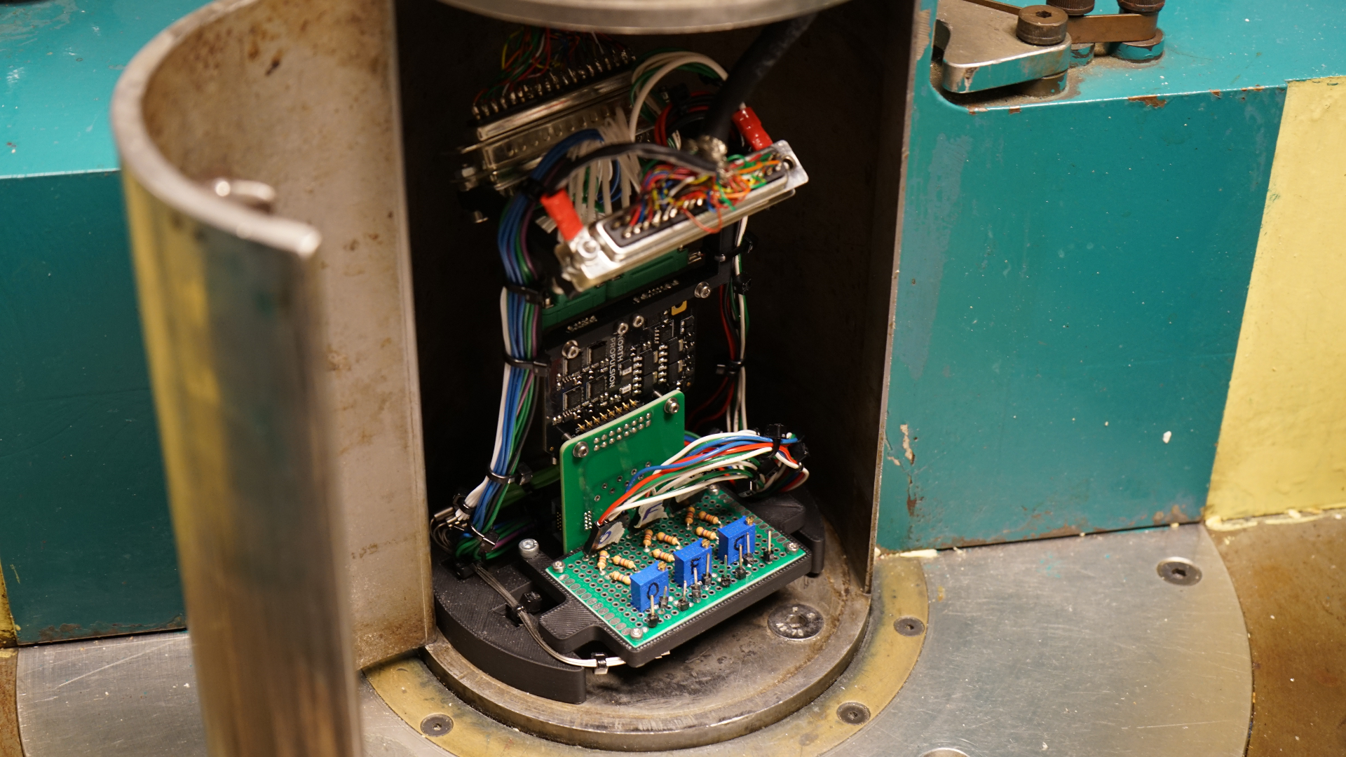 North Propulsion avionics board inside a radiation test chamber